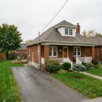 Detached older brick bungalow in East Hamilton with a deep rear yard — multi-unit conversion potential assessed by Gateway Group