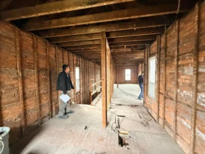 Side by side contractor quote comparison showing hidden costs in a Hamilton basement suite project