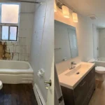 Hamilton bathroom mid-renovation showing subfloor removal and exposed cast iron drain stack — Gateway Group project 2025