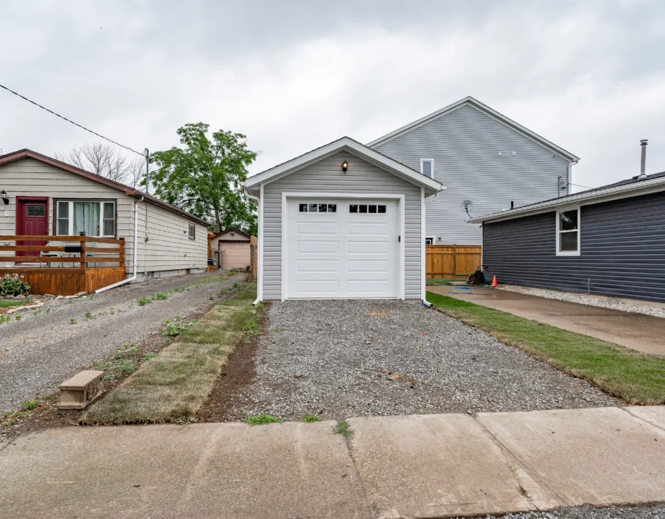 Homeowner reviewing a home renovation budget for a house in Hamilton, Ontario