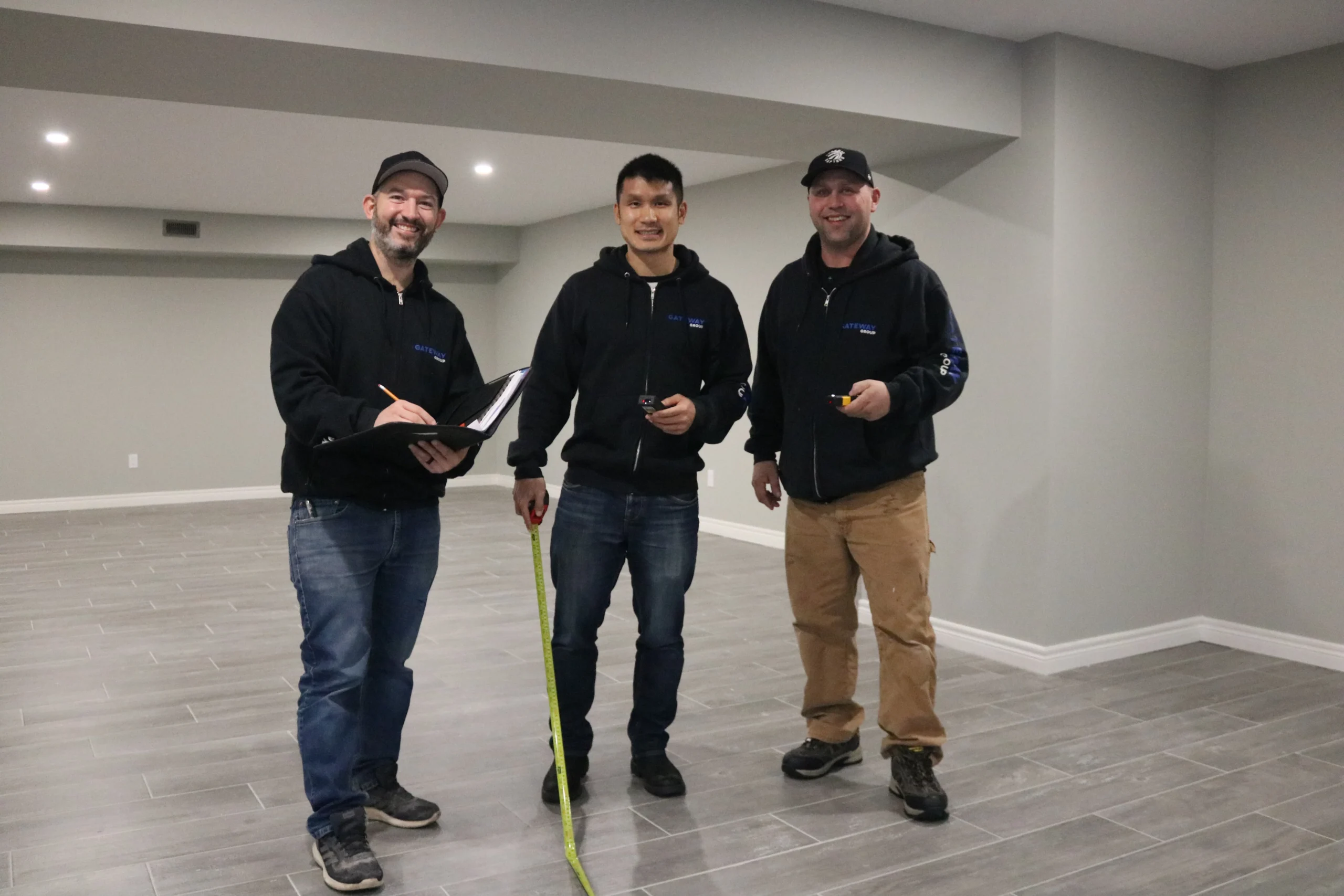 Gateway Group discussing a home renovation project with a homeowner in the Greater Hamilton Area