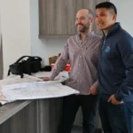 Property owner and contractor reviewing a renovation contract in Hamilton